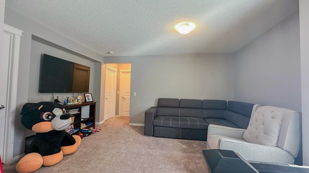 Stylish Auburn Bay Duplex With Garage & Newly Finished Basement - Photo 1