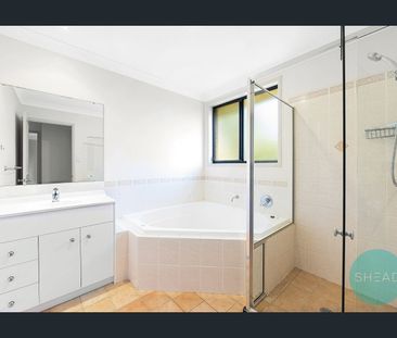 MODERN TWO LEVEL BRICK FAMILY HOME AT LEAFY LOCATION - Photo 1