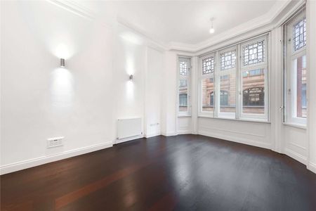 A first floor one bedroom apartment in a recently refurbished building benefitting from a generous reception room with 3.5m high ceilings, lift access and wooden flooring throughout. - Photo 4