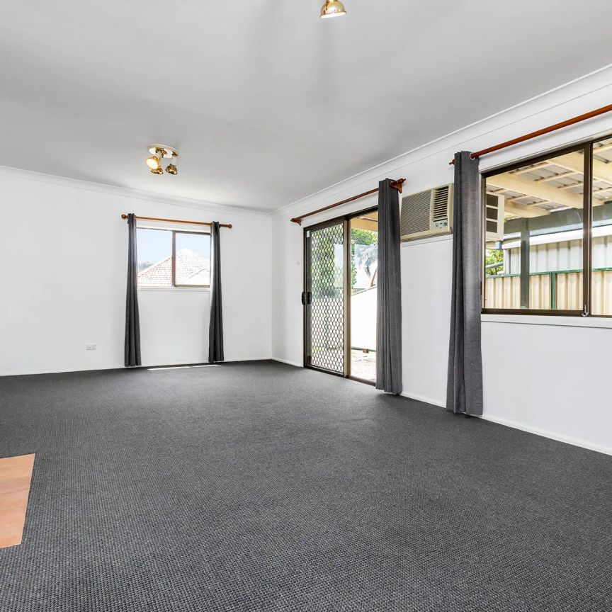 Neat Three Bedroom Home in Ideal Location - Photo 1