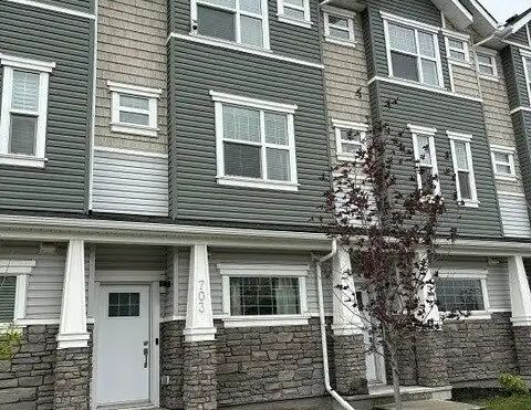 New 3 storey townhome in Airdrie — 2 Bedrooms+ Den Townhouse - Photo 1
