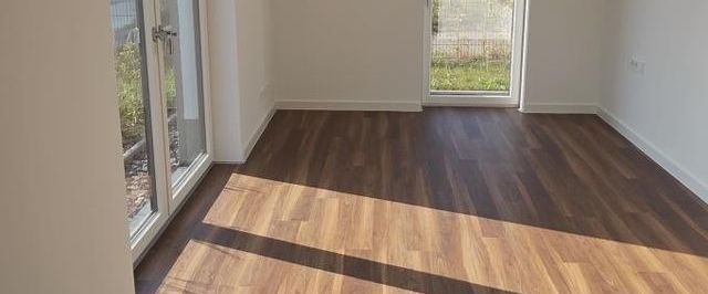 Ihr neuer Wohntraum im attraktiven Neubau, große Terrasse, ruhige Lage mit viel Grün! - Foto 1