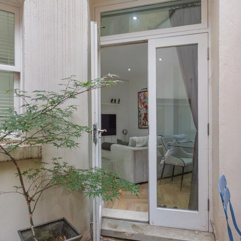 A beautiful garden apartment with bright living space and a private garden. - Photo 1