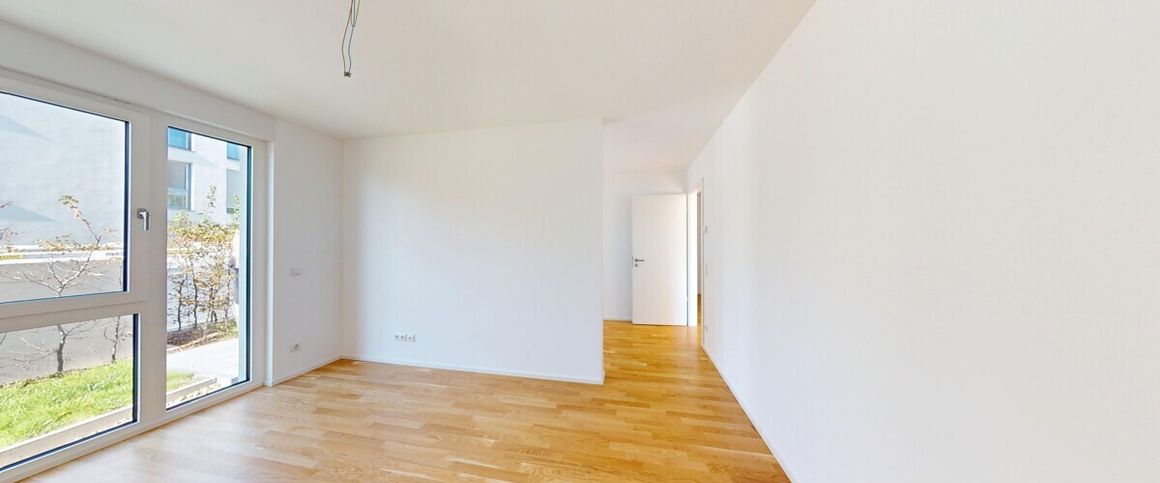 Neubau-Erstbezug: Attraktive Wohnung mit sonnigem Balkon und Erdgeschossterrasse! - Foto 1