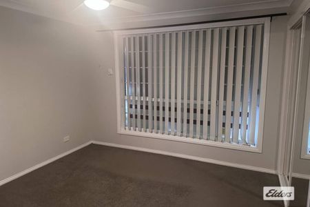 Comfortable Family Home with Double Garage - Photo 3