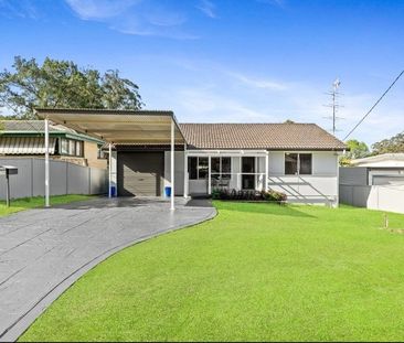 Family home with multiple living zones and large fenced yard - Photo 4