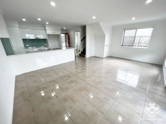 Townhouse - Garage and Carport - Photo 1