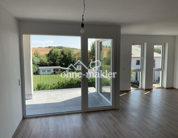 Neubau in Feldrandlage: 3-Zimmer-Wohnung mit Gartenzugang von allen Räumen mit Abendsonne & Ausblick - Photo 1