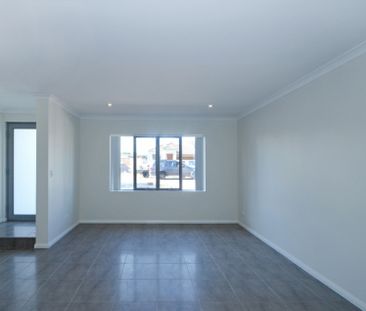 Stylish, Spacious & Secure! Modern Townhouse Living at Its Best! - Photo 1