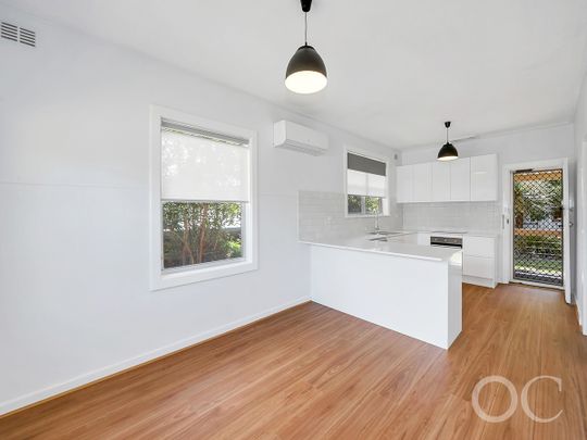 Open the door to coastal living with a sunlit deck retreat - Photo 1