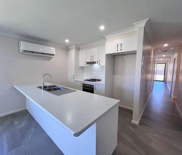 NEAR NEW 4 BEDROOM HOME - Photo 3