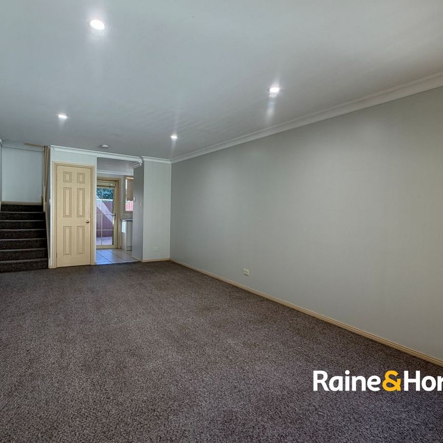 Neat & Low-Maintenance Townhouse in Convenient Location - Photo 1