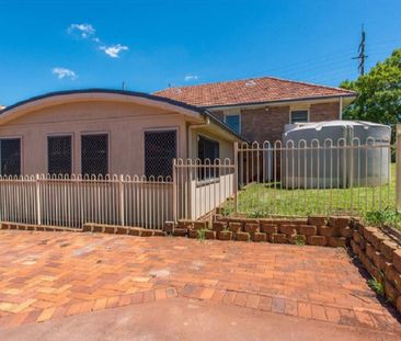 The Whole Package! Spacious 5-Bedroom Home + Sheds Galore! - Photo 2