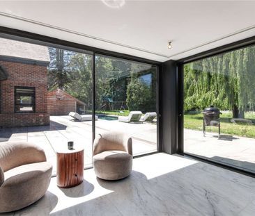 An immaculately curated village home set in gardens with a pool and... - Photo 2