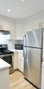 MODERN and very spacious 2 bedroom suite - utilities included! - Photo 3