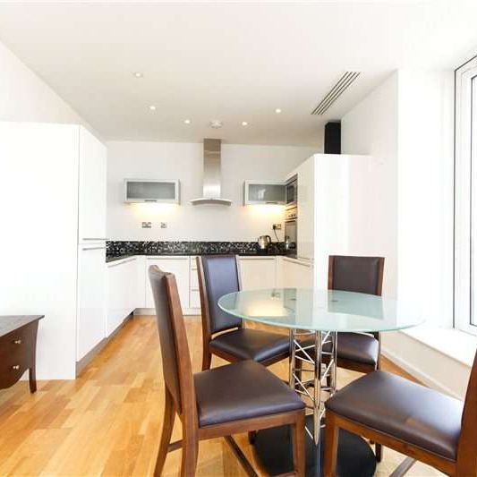 A modern 2 bedroom penthouse situated on the 21st floor of this striking residential development located close to the heart of Canary Wharf's financial district. - Photo 1