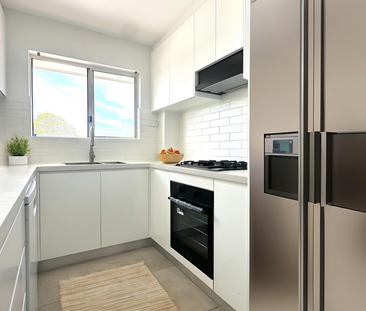 FULLY RENOVATED FLOOR 2 BEDROOM UNIT 500M TO AUBURN STATION - Photo 6