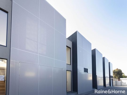 NEWLY BUILT! ARCHITECTURAL TOWNHOUSE IN BRUNSWICK AWAITS YOU - Photo 1