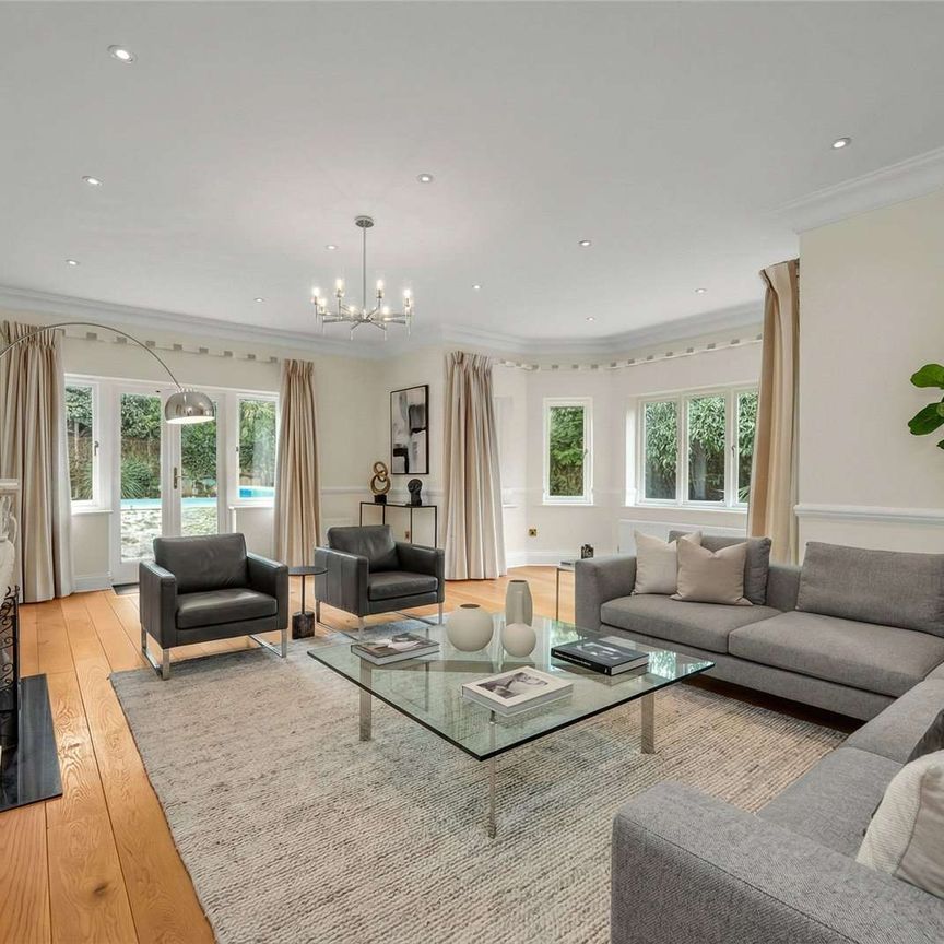 Situated in grounds of just over half an acre and located in one of Esher's most sought after private roads close to High Street. - Photo 1