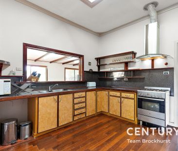 Charming 1950s Home with Modern Flexibility & Pristine Gardens! - Photo 1