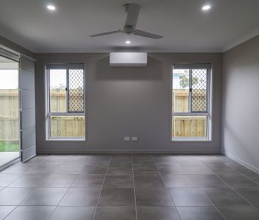 COASTAL COMFORT MEETS EASY LIVING AT 2 CHELSEA DRIVE! - Photo 1