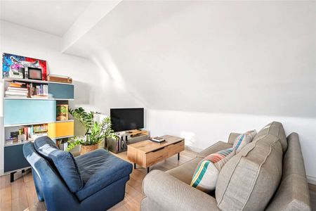 A bright and immaculately presented two-bedroom/two-bathroom top floor apartment, with a small balcony and first floor entrance, within a stunning Victorian building on a tree-lined street. - Photo 2