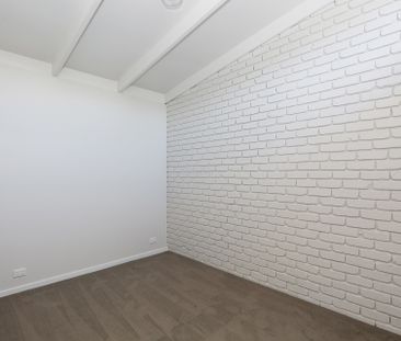 A newly renovated 1-bedroom unit - Photo 1
