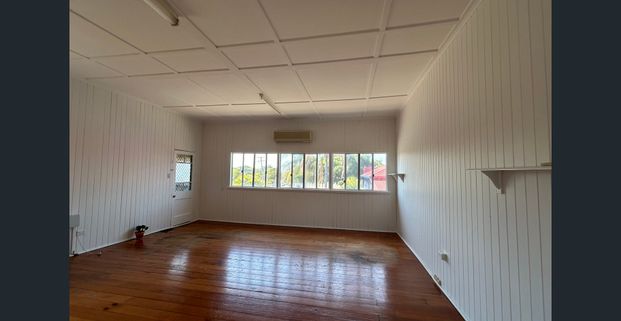 SPACIOUS QUEENSLANDER WITH EXTRA MULTI PURPOSE ROOM AVAILABLE NOW! - Photo 1