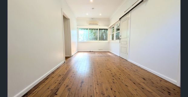 Charming Family Home with Spacious Interiors and Leafy Garden Retreat - Photo 1