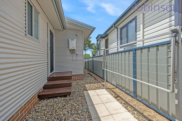 Three bedroom, two bathroom townhouse with double auto-door garage - Photo 1