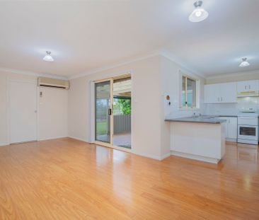 Tidy 3 Bedroom Home with Large Backyard! - Photo 2