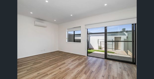 **RECEIVE ONE MONTH FREE RENT, ASK US HOW! Modern 4-Bedroom Townhome for Lease in Cloverton Estate - Photo 1