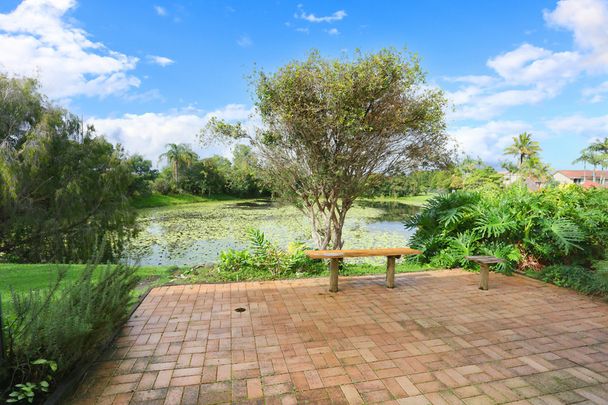 GATED COMPLEX OVERLOOKING THE LAKE - Photo 1
