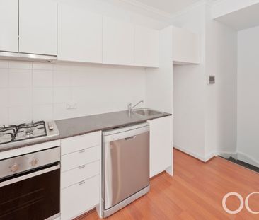 Open the Door to City Serenity with a Private Balcony - Photo 6