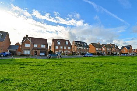 Situated in a peaceful location with open green space to the front, this spacious family home is arranged over three floors and offers well-presented accommodation throughout. - Photo 4