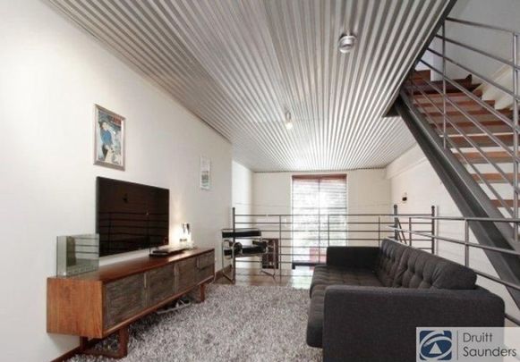 Stunning tri-level townhouse in historic warehouse conversion - Photo 1