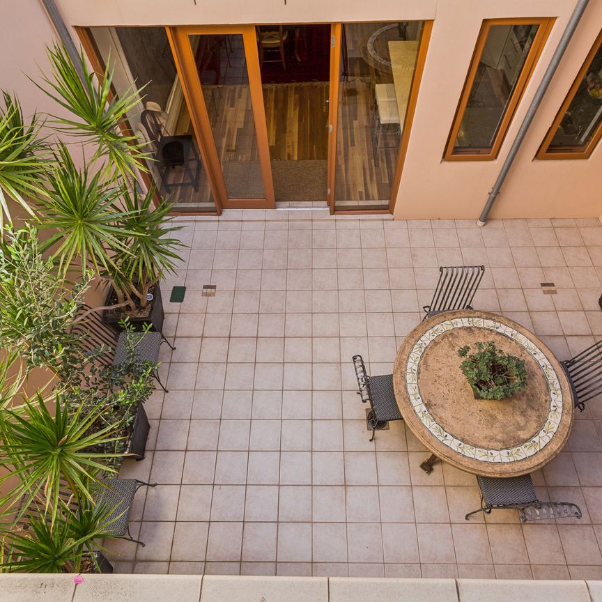Open the Door to a Mediterranean-Inspired Courtyard Escape in the Heart of the CBD - Photo 1