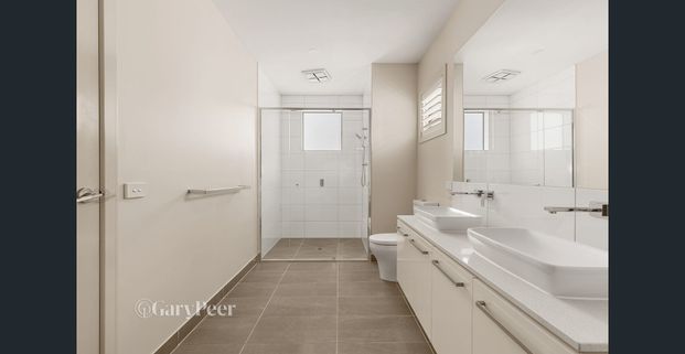 Contemporary Style Meets Lifestyle Convenience in the McKinnon Secondary Zone - Photo 1