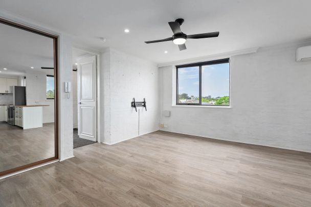 Light-Filled Top-Floor Sanctuary with Sweeping Views and Exceptional Space - Photo 1