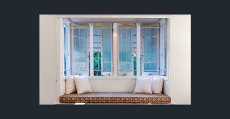 Renovated Highset Queenslander with Deck, Dual Living Areas & Water Glimpses - 200 Meters To The Water - Photo 3