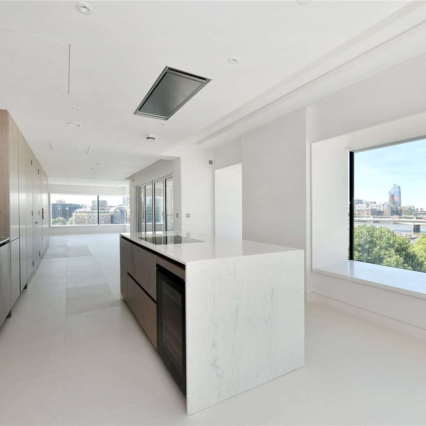 A beautifully appointed 3 bedroom, 3 bathroom sub penthouse apartment situated on the 6th floor of this modern development, located for the City, situated directly on the River Thames. - Photo 1