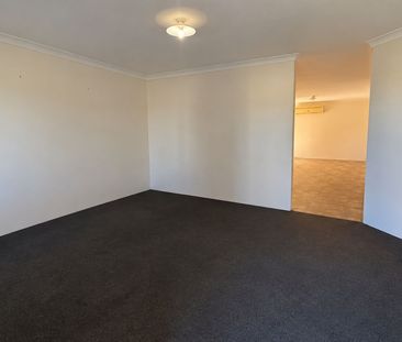 Neat 4-Bedroom Home with Monthly Lawn Mowing Included - Photo 2