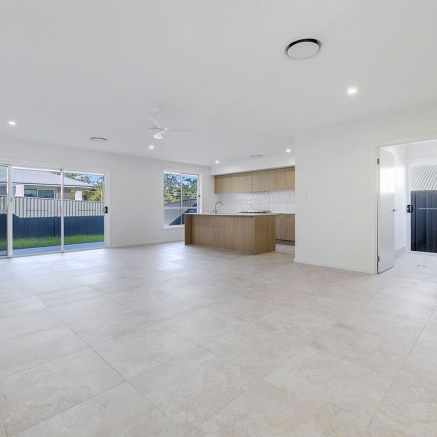 Stylish New Home with Bright Modern Interiors - Photo 1