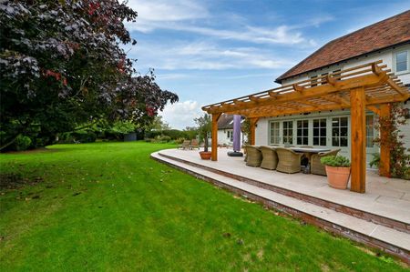 A beautifully presented detached home with private driveway, double garage and fully furnished interiors including five bedrooms in village setting - Photo 2