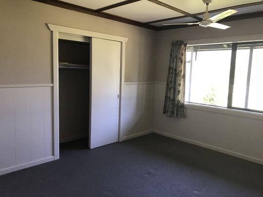 This is a neat and tidy, two bedroom unit at the front of the property, it has open plan kitchen, dining and living with double doors that open out to the deck, a bedroom off either side of the lounge, and the bathroom with shower, toilet and vanity. - Photo 1