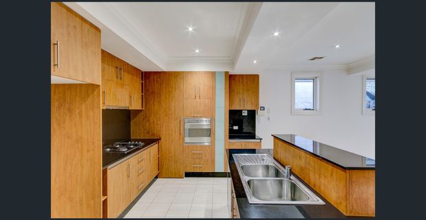 FAMILY SIZED TOWNHOUSE” - Photo 1