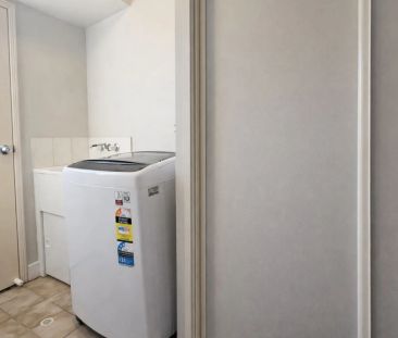 Spacious 4-Bedroom Family Home with Air-Conditioning Throughout - Photo 4