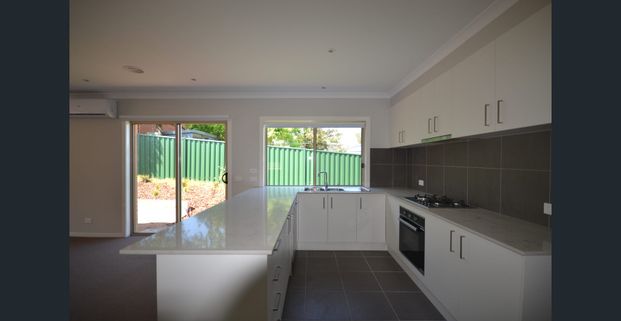 Modern & Low-Maintenance Home with Double Garage - Photo 1