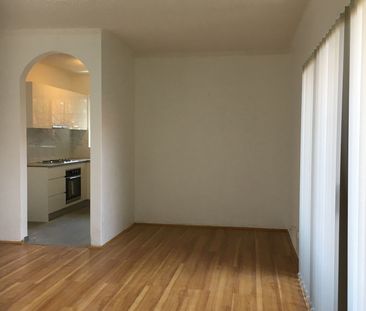 CONVENIENTLY LOCATED 2 BEDROOM UNIT - Photo 1
