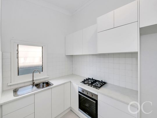 Open the Door to Coastal Charm with Modern Comfort - Photo 1